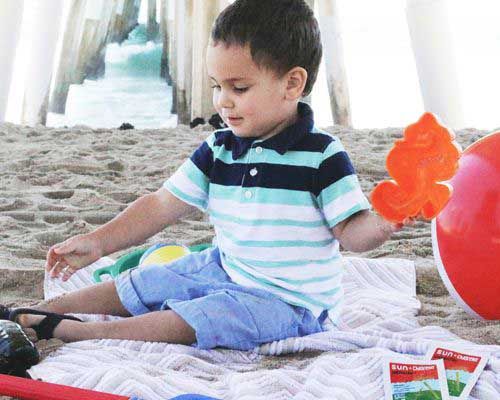 Child playing at the beach - Sun Chlorella USA