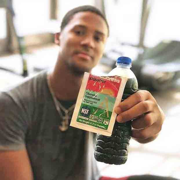 Man holding Chlorella Drink