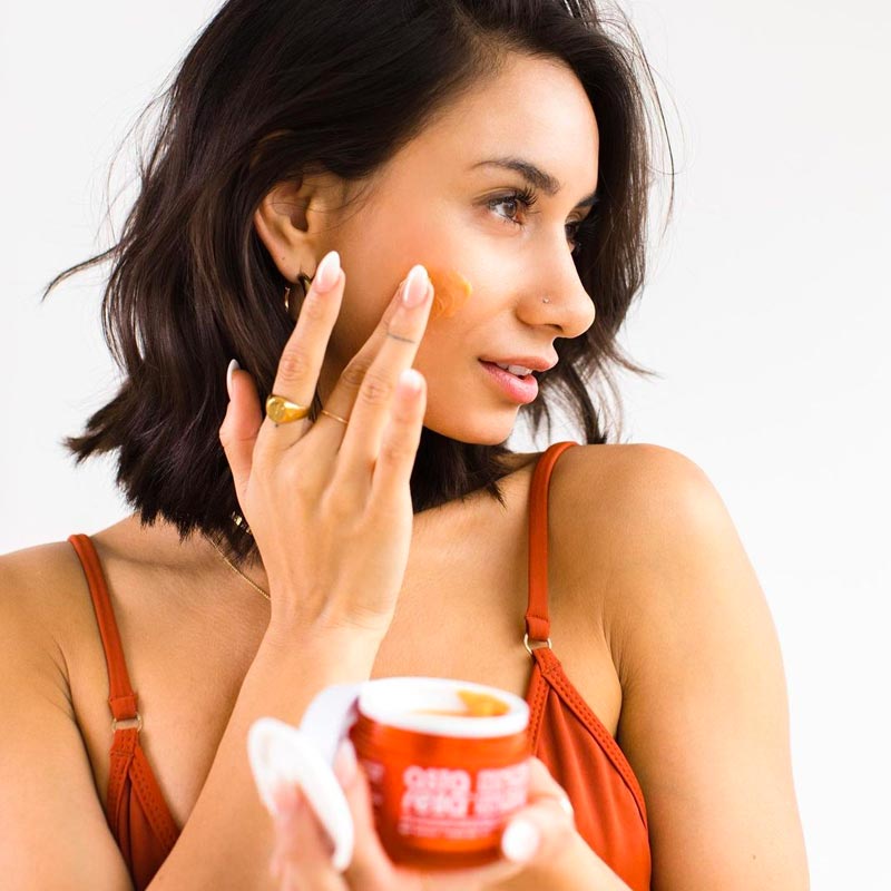 Natasha putting on Astarella Primetime Skin Cream on her face Natasha putting on Astarella Primetime Skin Cream on her face