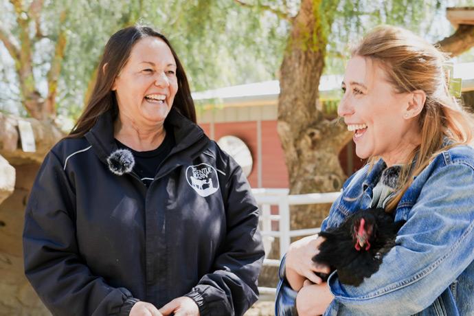 Ellie Laks and Jen Jimenez smiling each other