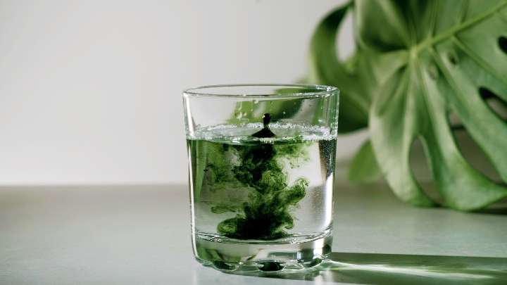 Chlorella poured into water glass