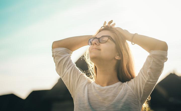 Woman with glasses taking in the sun