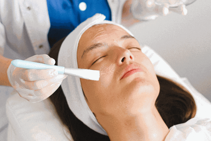 Woman receiving skincare treatment from doctor