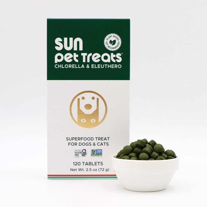 Sun Pet Treats Chlorella Superfood Treat for Pets with full of tablets in a white ceramic bowl