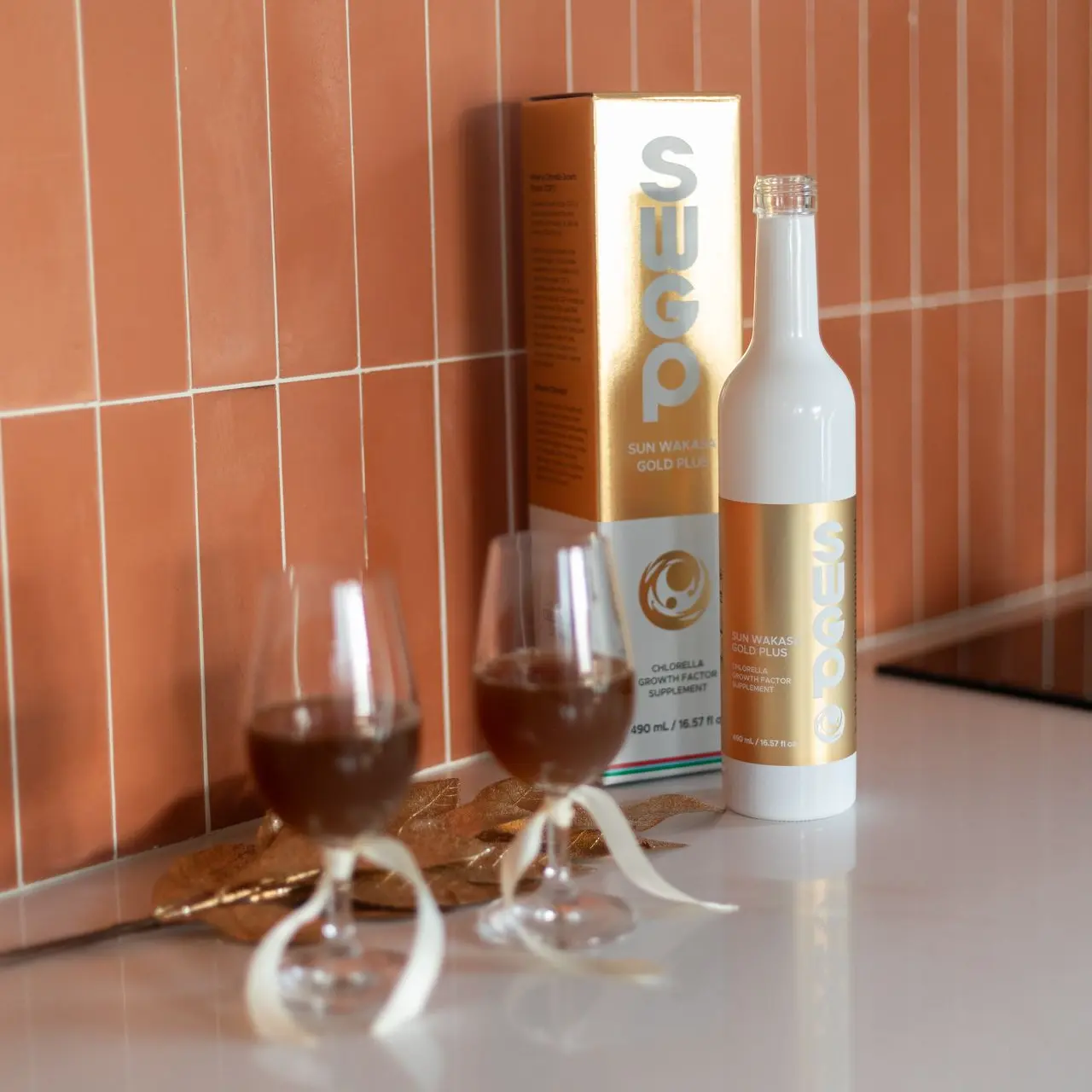 Golden Harvest Gift Set | Includes 2 Bottles of Sun Wakasa Gold + Free Travel Kit A bottle of Sun Wakasa Gold Plus behind two glass half filled